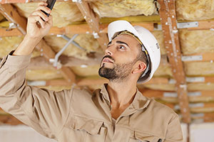 man working on ceiling