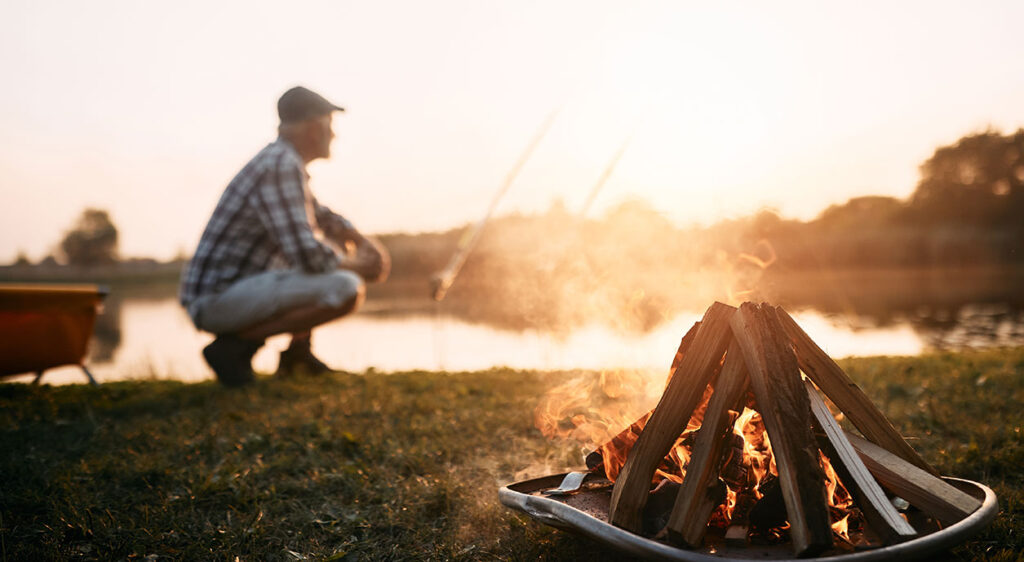 man fishing on a lake
