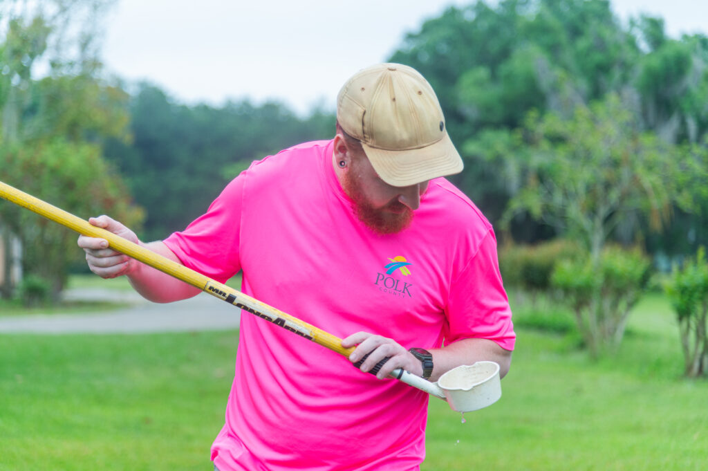 polk county scientist looking at water sample