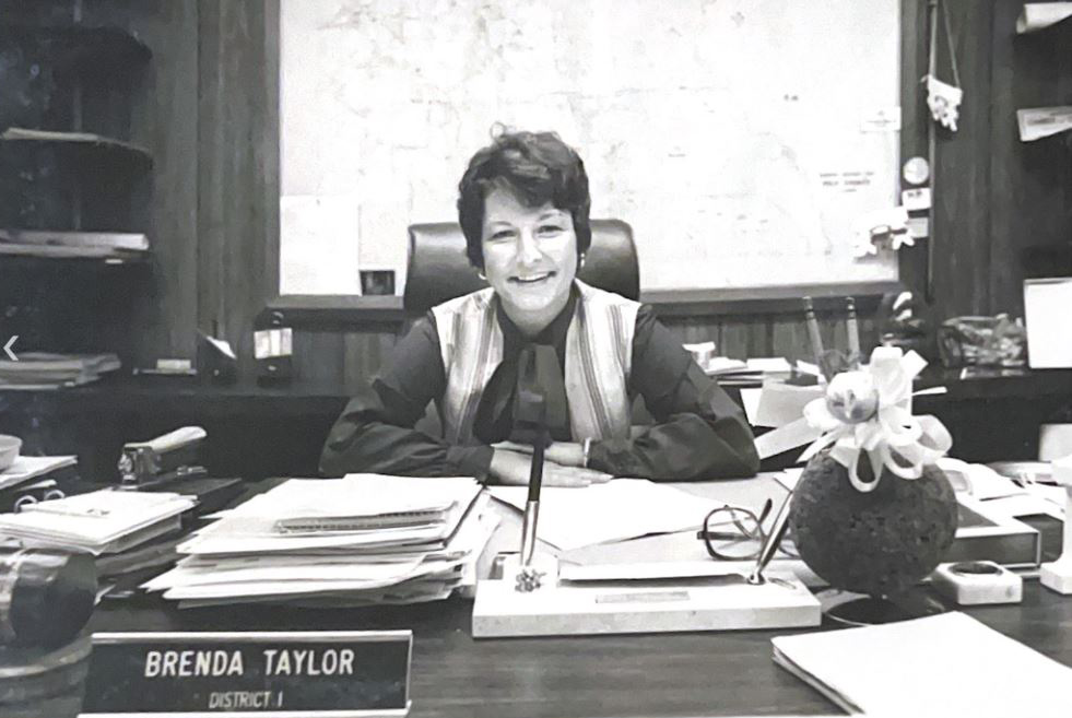 Brenda Taylor, District 1 commissioner, sitting at her desk in her office