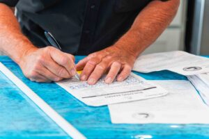 Polk building inspector filling out paperwork on site