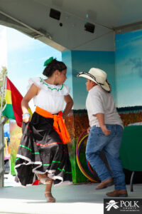 Young hispanic boy and girl dancing