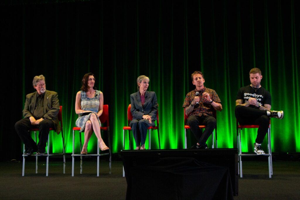 From left to right, sitting on a stage: Risdon Slate, Trish Kendall, Ellen Snelling, Anthony Alvarado, Johnny Crowder