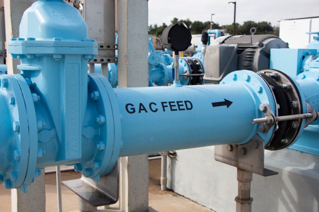 blue pipe with letters "GAC Feed"