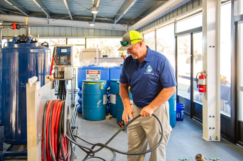 Polk County Utilities professional Buddy the Water Buddy operating advanced water treatment equipment inside the Direct Potable Reuse Pilot facility, supporting purified drinking water and sustainable water recycling in Florida.
