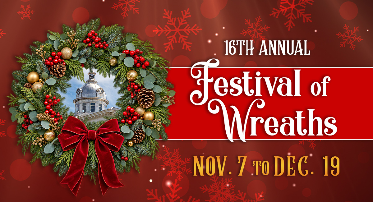 Holiday wreath with a red bow framing the Polk County History Center’s clock tower against a red snowflake background. The text read "16th Annual Festival of Wreaths. Nov. 7 to Dec. 19"